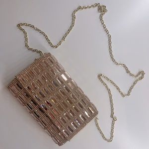 Rose Gold jewled BeBe clutch.